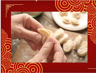 Hands folding dumpling.