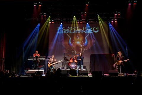 5 guys on a stage