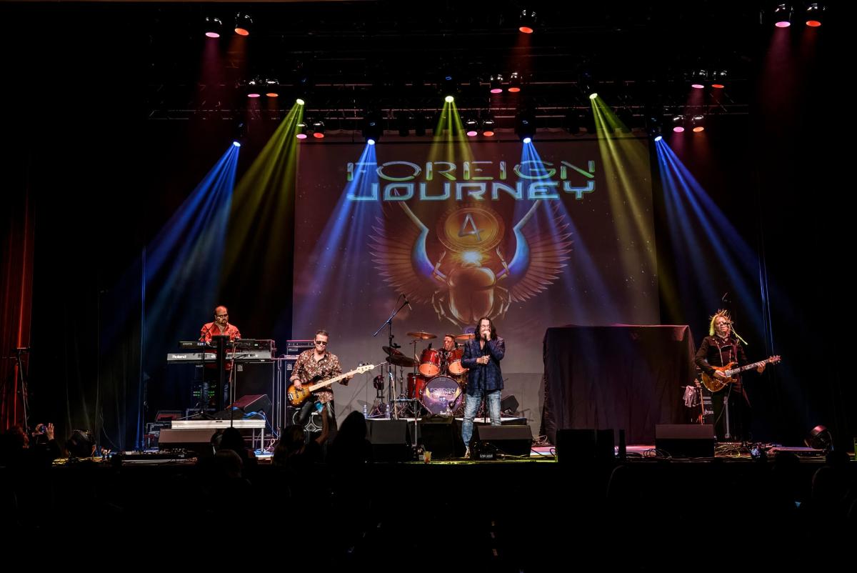 5 guys on a stage